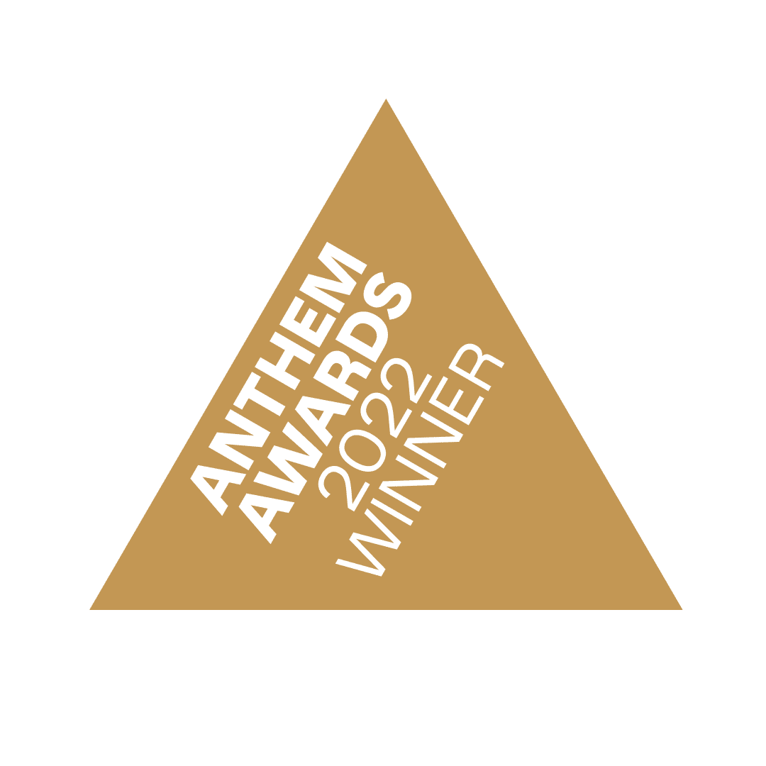 Gold triangle with white letters that read, "Anthem Awards 2022 Winner"